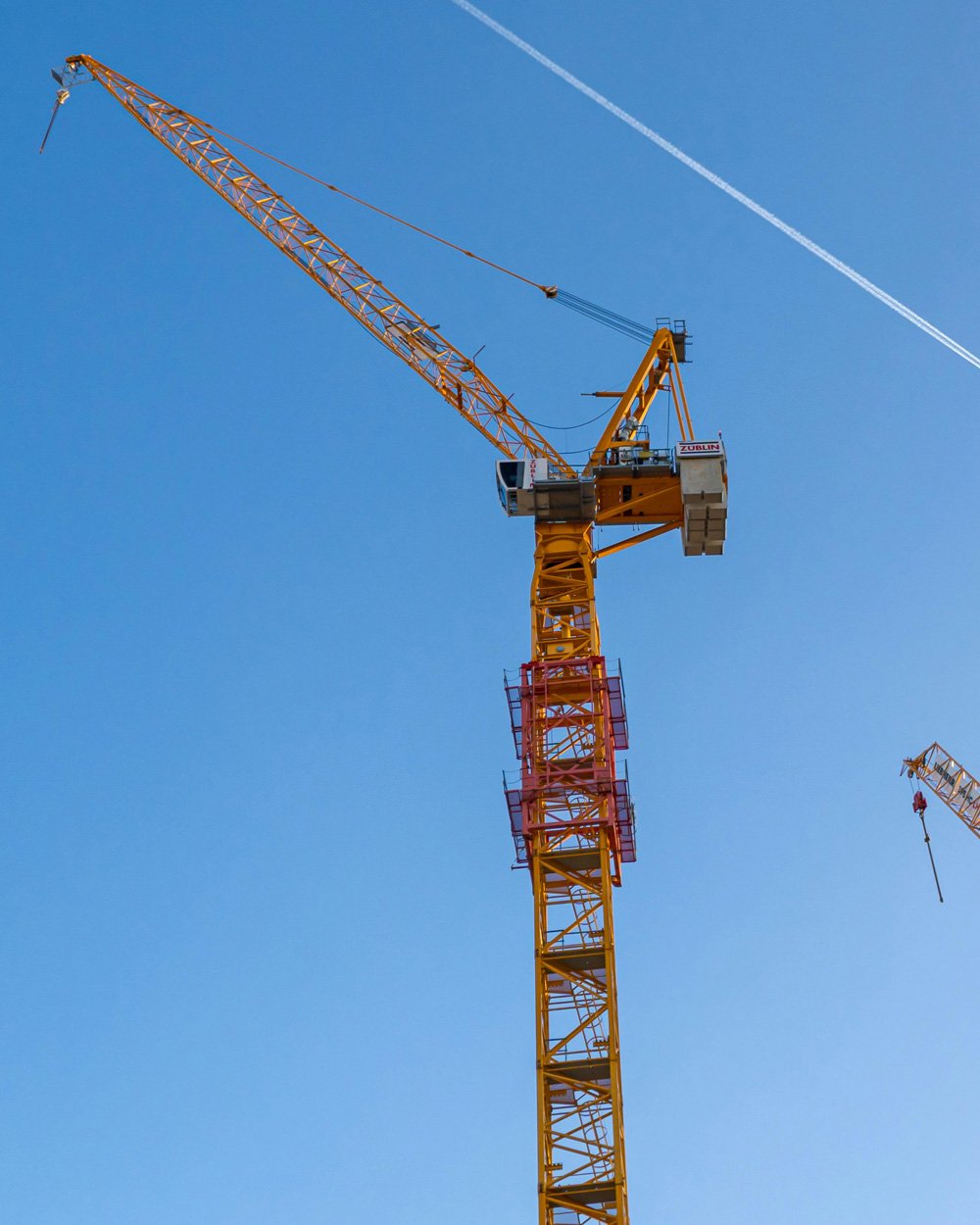 A tower crane, photographed from below.